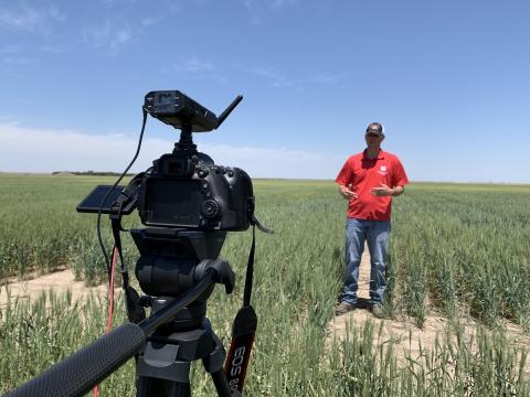 Cody Creech being recorded in a field